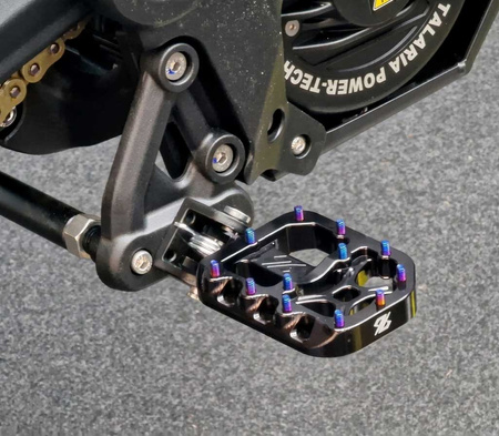 96 Power Parts wide footpegs in black mounted on a Talaria MX5